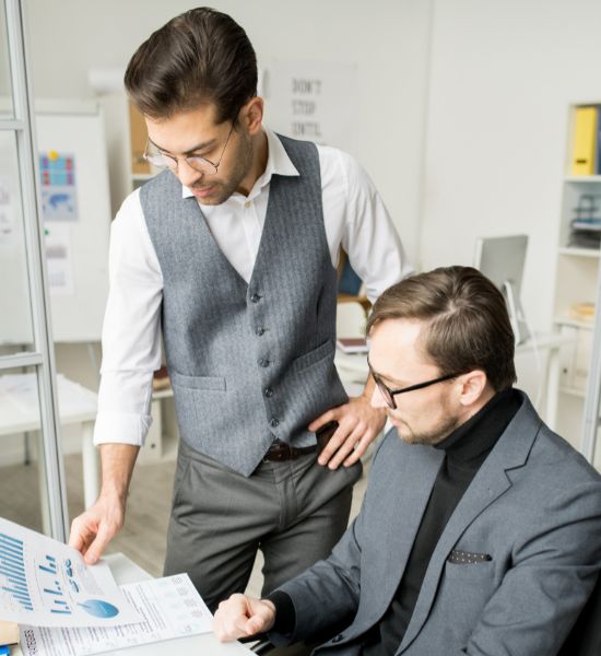 Two professionals reviewing launch data